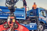 Renault Trucks D Wide electric with a man operating the crane